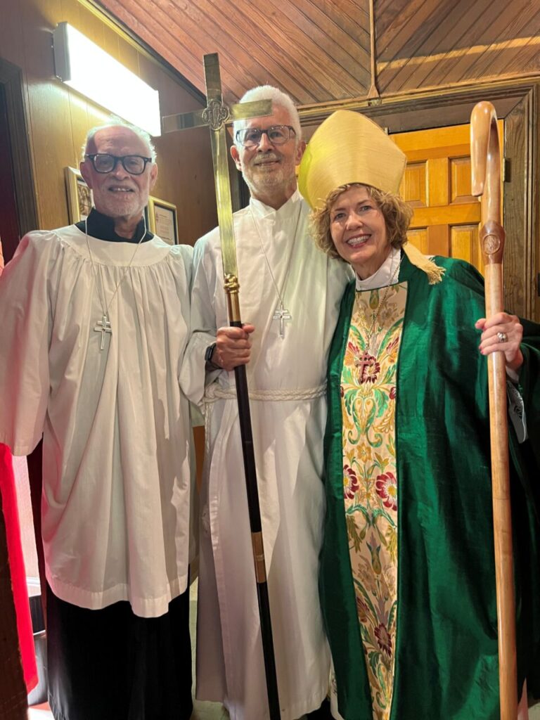 Bishop Ruth Woodliff-Stanley with Tommy and Eric Bultman, servers, at Good Shepherd, Sumter visitation on June 7, 2026